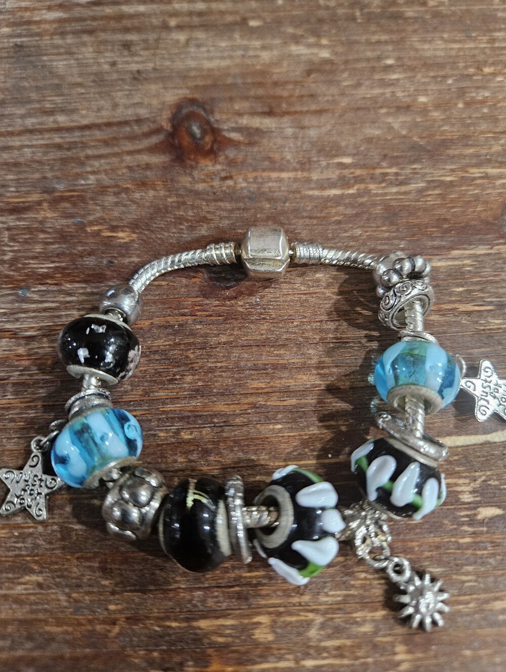 Silvertone Bracelet with Blue, Black & White Glass Beads and Sun Charm